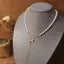 Radiant Butterfly Tassel Necklace – Elegant Pearl & Long Chain Pendant